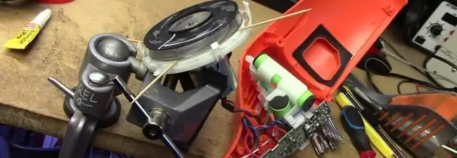 Vacuum cleaner repair parts and tools on a workbench in Houston, TX
